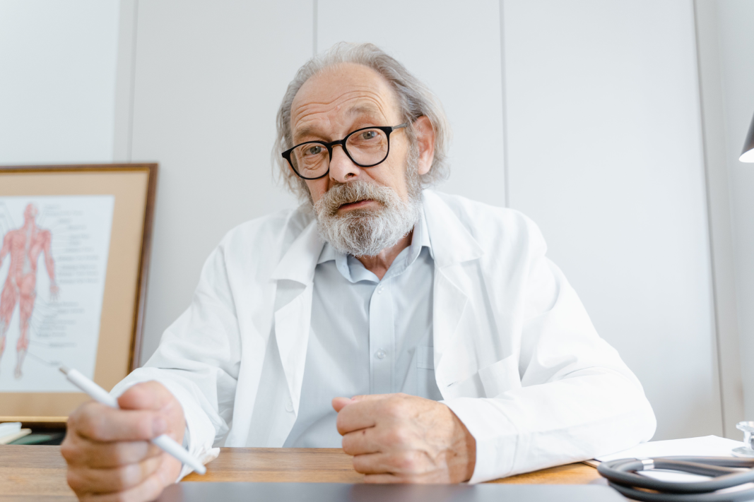 Physician discussing clinical decision-making during a research interview